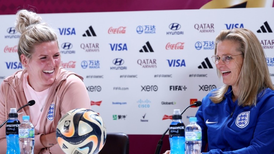 England coach Sarina Wiegman and defender Millie Bright (L) at a press conference ahead of the World Cup final