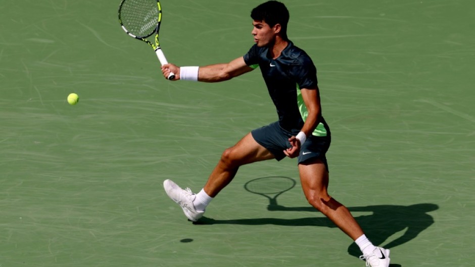 World number one Carlos Alcarez of Spain hits a forehand in his third-round victory over Tommy Paul at the ATP/WTA Cincinnati Open
