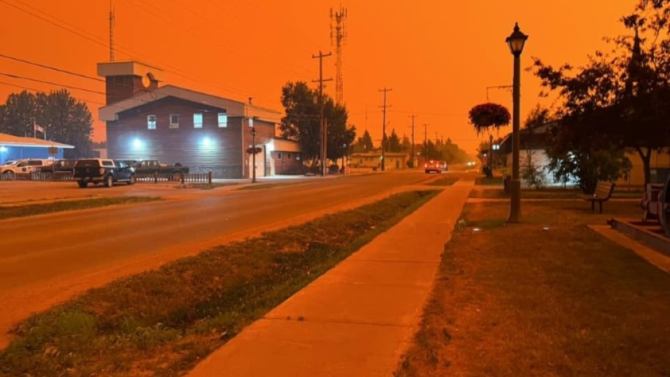 The town of Fort Smith in an orange haze as wildfires sweep Canada's far north