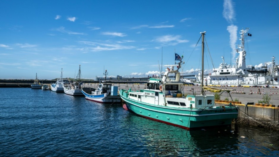 Fishing boats moored at Onahama port in Iwaki city. Japan's government will decide on Tuesday about the release of treated water from the crippled Fukushima nuclear plant nearby
