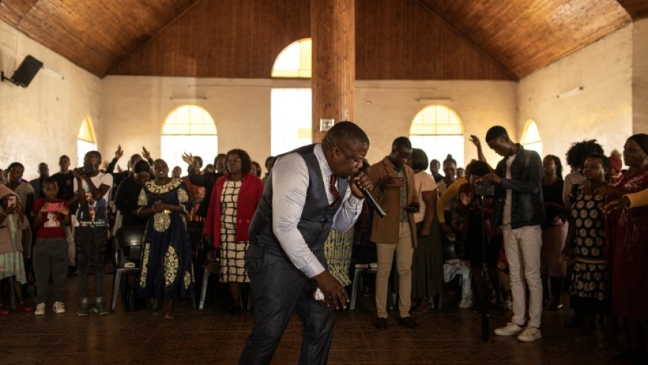 A pastor of the Apostolic Faith Mission addresses the congregation at Harare's Gospel Fire Cathedral