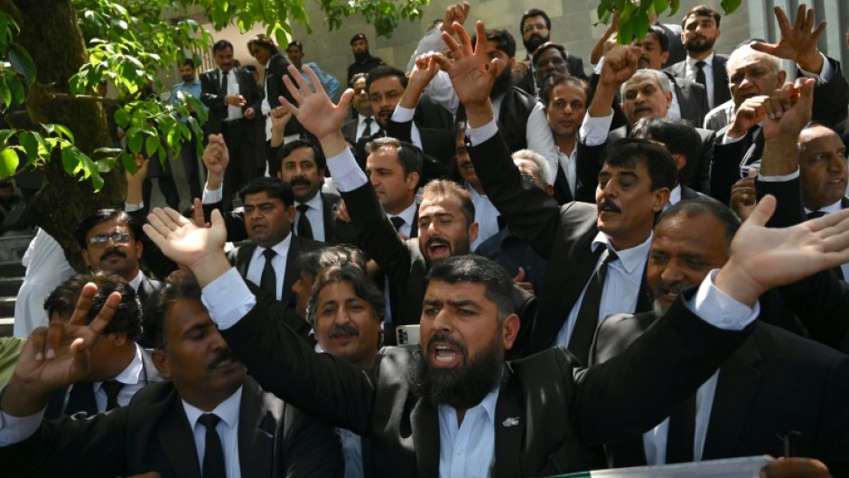 Lawyers and supporters of Pakistan's former prime minister Imran Khan outside the Islamabad High Court after the suspension of Khan's prison sentence for a graft conviction