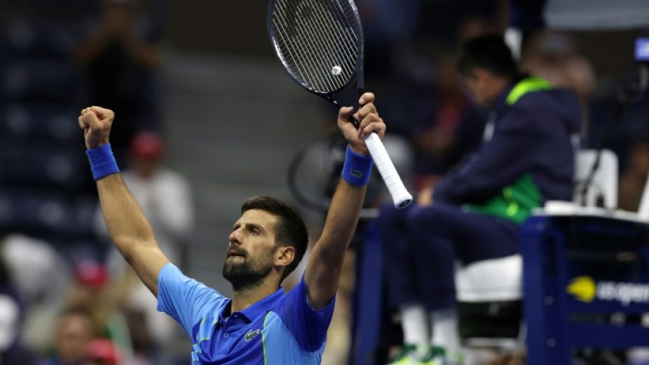 Novak Djokovic celebrates after his five-set victory in the US Open third round on Friday
