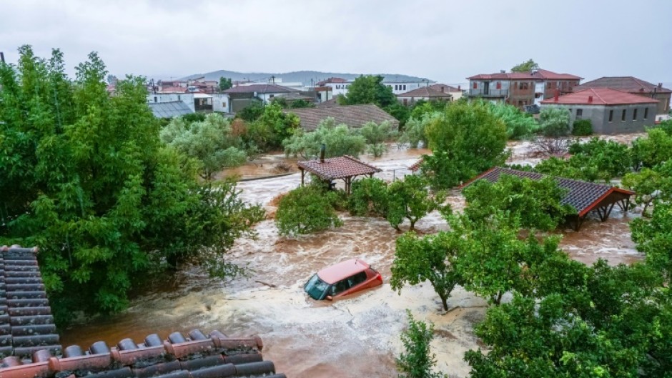 Cars and homes taking in water at Volos on Tuesday