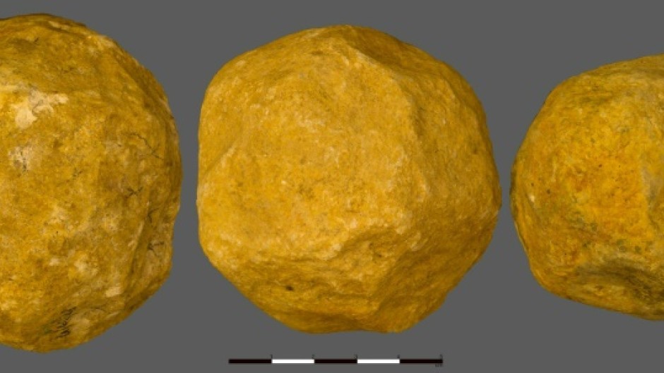 Three limestone "spheroids" from the 'Ubeidiya site in Israel, which researchers believe were deliberately made into spheres 1.4 million years ago