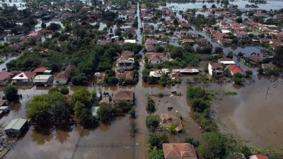 Several houses remain under water in the village of Palamas