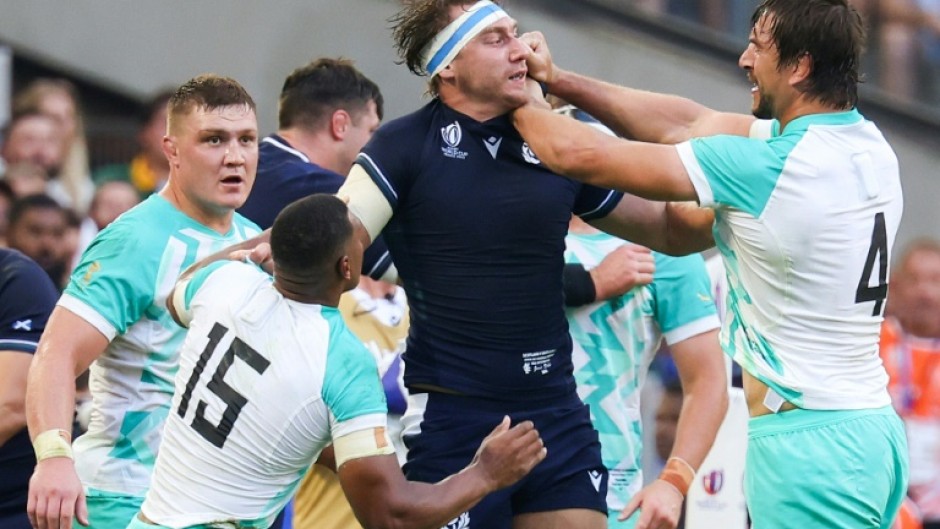 South Africa lock Eben Etzebeth (right) grapples with Scotland's flanker and captain Jamie Ritchie during their World Cup opener