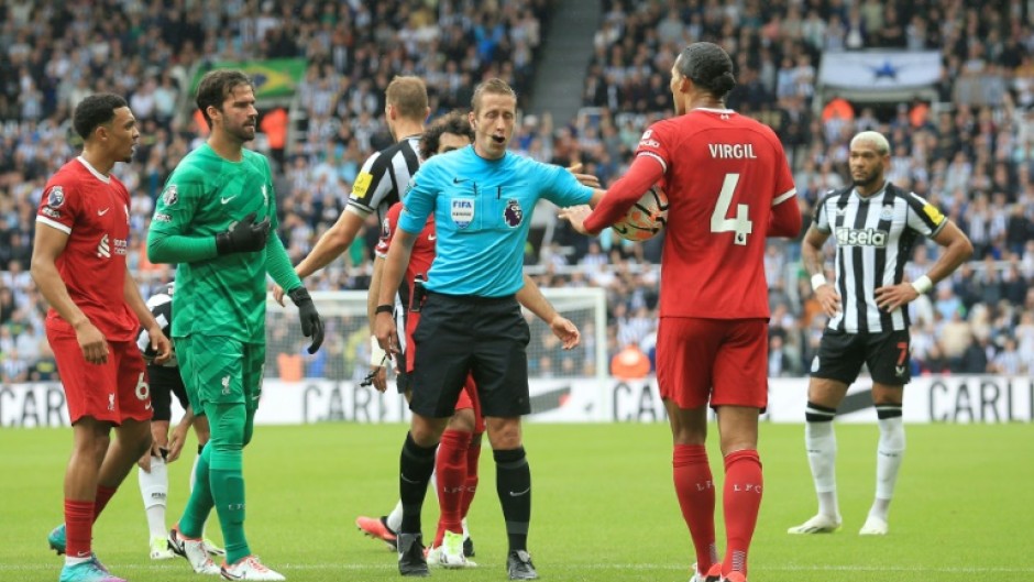 Liverpool defender Virgil van Dijk (2R) was sent off at Newcastle