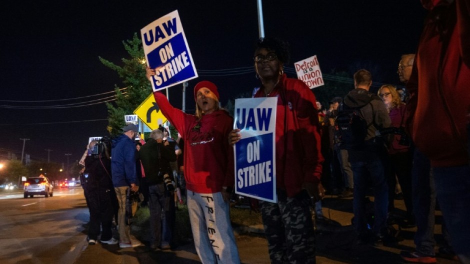 UAW members picket outside of the Local 900 headquarters across the street from a Ford assembly plant in Wayne, Michigan on September 15, 2023