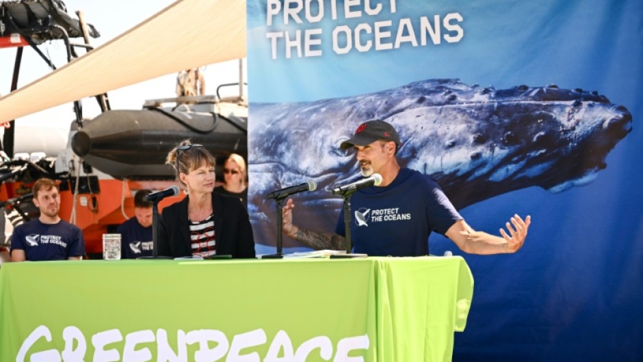 Marine experts and Greenpeace activists speak during a launch event for a Greenpeace report calling for ratification of a global oceans treaty to protect marine biodiversity and fish stocks
