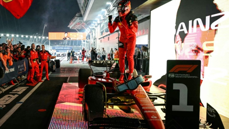 Ferrari's Spanish driver Carlos Sainz Jr celebrates winning the Singapore Formula One Grand Prix night race at the Marina Bay Street Circuit in Singapore on September 17, 2023.
