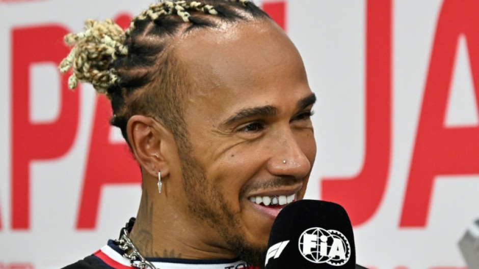 Mercedes' British driver Lewis Hamilton speaks to the media before the Formula One Japanese Grand Prix at Suzuka