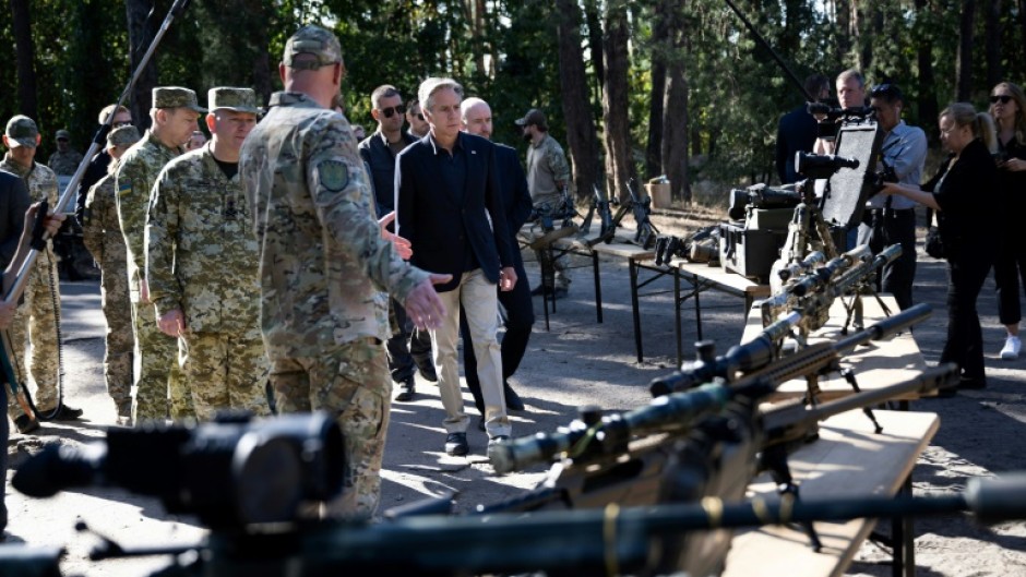 US Secretary of State Antony Blinken, an advocate for providing military aid to Ukraine, looks at weapons while he tours a Ukraine supply site near Kyiv on September 7, 2023