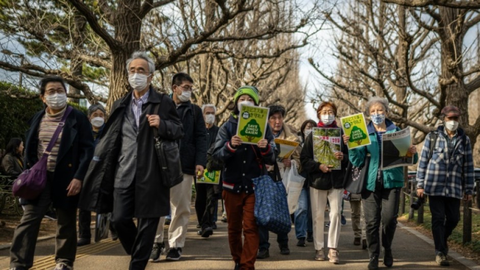 People take part in a protest earlier this year against the redeveopment of a rare green area in central Tokyo