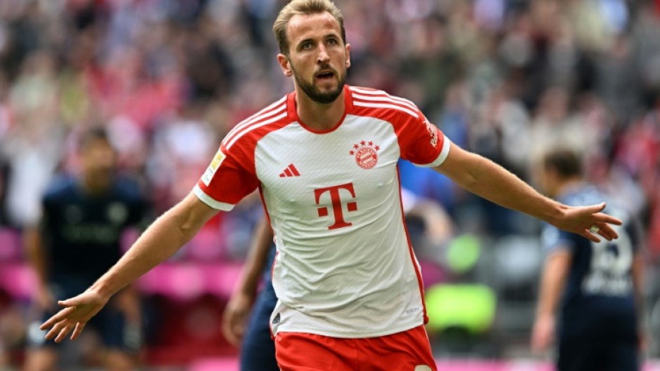 Record-breaker: Bayern Munich's Harry Kane celebrates scoring a hat-trick in the 7-0 win over Bochum on Saturday