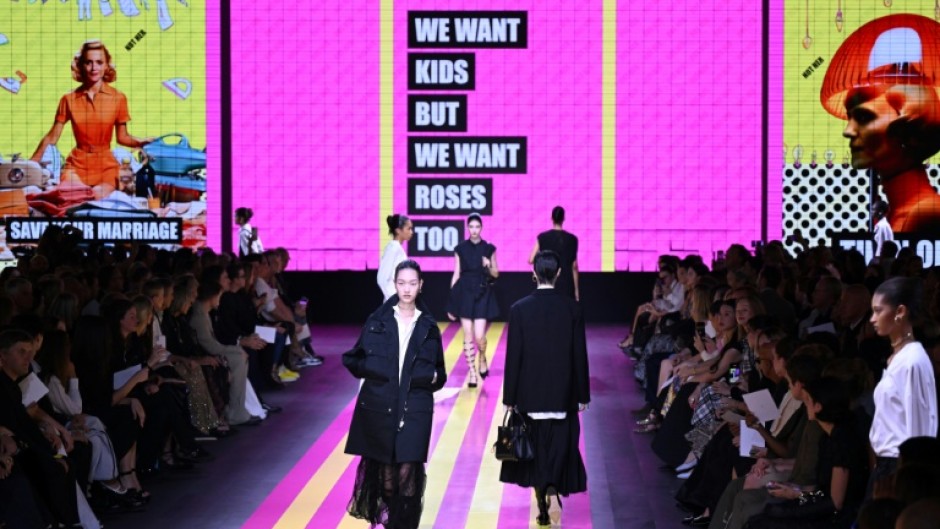 The new collection included outfits that matched the billowing silhouette of the British queen's midnight-blue silk dress