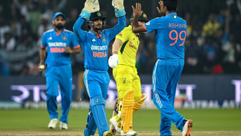 India's Ravichandran Ashwin (R) made a triumphant return to ODI cricket against Australia