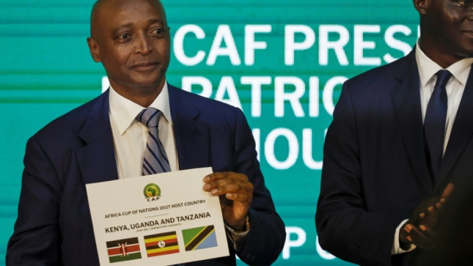 Patrice Motsepe, president of the Confederation of African Football, reveals the host countries for the 2027 Africa Cup of Nations at a ceremony in Cairo 