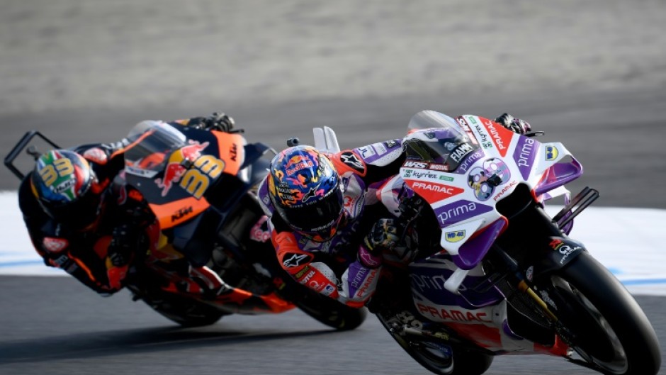 Prima Pramac Racing rider Jorge Martin of Spain (R) wins the sprint race of MotoGP Japanese Grand Prix in Motegi