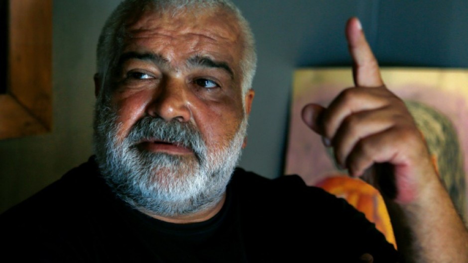 Khaled Khalifa speaks during an interview with AFP at his home in the Syrian capital Damascus in 2020