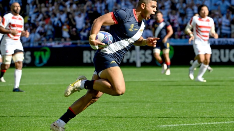 Argentina centre Santiago Chocobares runs to score the opening try against Japan