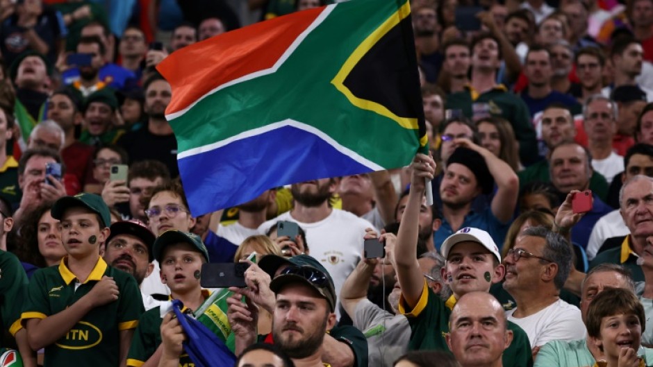 Spectators wave a South Africa flag at a Rugby World Cup game in Marseille