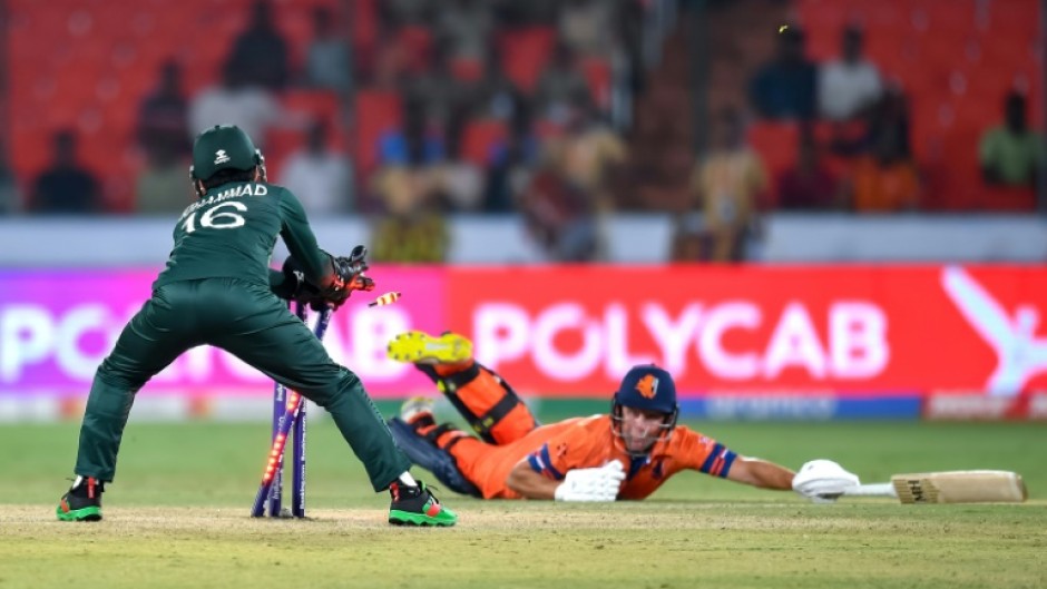 That's out: Pakistan's Mohammad Rizwan runs out Netherlands' Roelof van der Merwe in the opening game