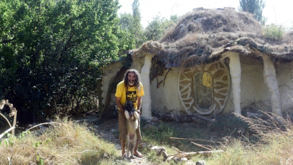 Ackov and his dog outside his home near Veles in North Macedonia 