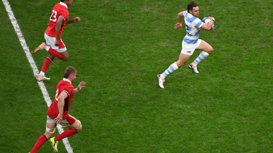 Argentina fly-half Nicolas Sanchez (right) streaks clear to score the match-clinching try in the World Cup quarter-final against Wales