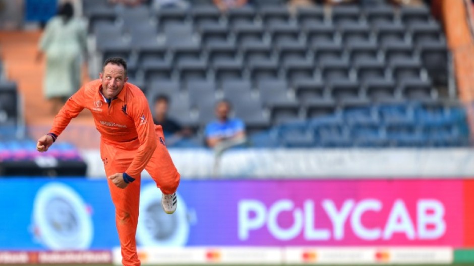 Familiar face: Netherlands' Roelof van der Merwe bowls during the World Cup match with New Zealand in Hyderabad 