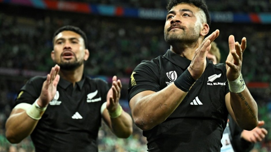 New Zealand No 8 Ardie Savea (L) and fly-half Richie Mo'unga (R) celebrate after beating Ireland