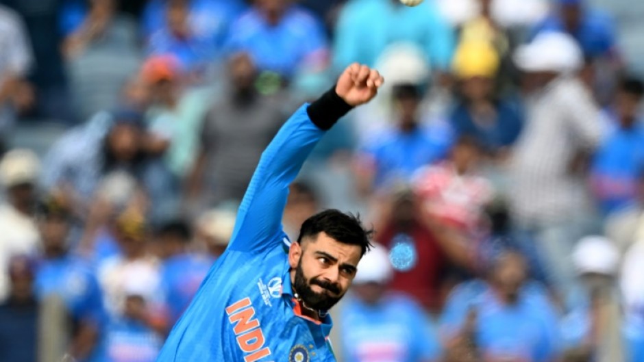 Bowling not batting: India's Virat Kohli bowls in a ODI for the first time in six years on Thursday during the World Cup match against Bangladesh