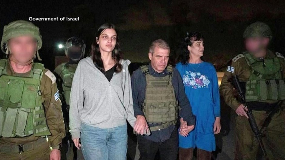 This handout picture courtesy shows Natalie Shoshana Raanan (2nd L) and Judith Tai Raanan (2nd R) after being released by Hamas at an undisclosed location