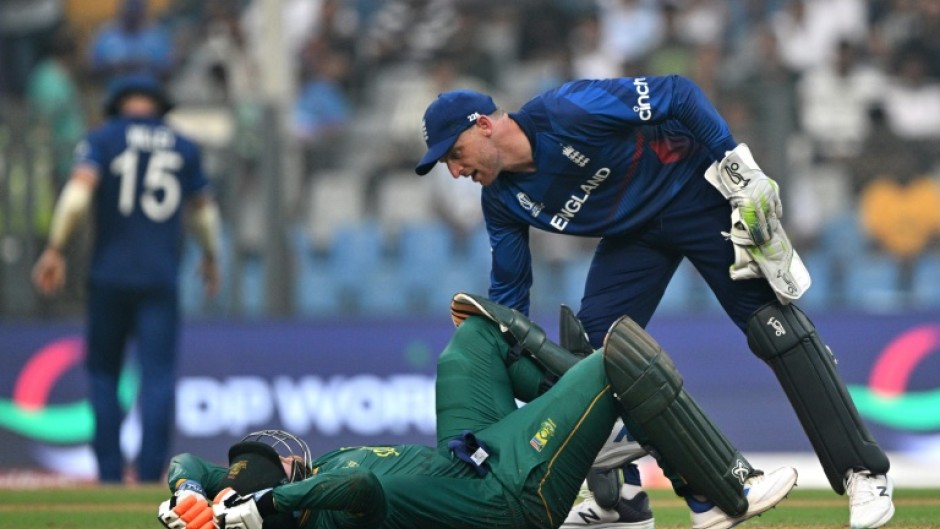 Cramping my style: England captain Jos Buttler helps South Africa century-maker Heinrich Klaasen who struggled with cramp