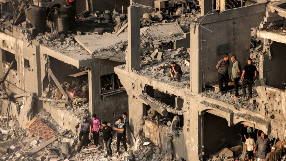 Gazans are struggling to reach people crushed under buildings hit by Israeli air strikes, with many using their bare hands to try and dig them out