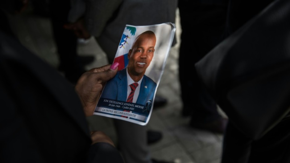 A picture of late Haitian President Jovenel Moise being held during a ceremony at the National Pantheon Museum in Port-au-Prince, Haiti