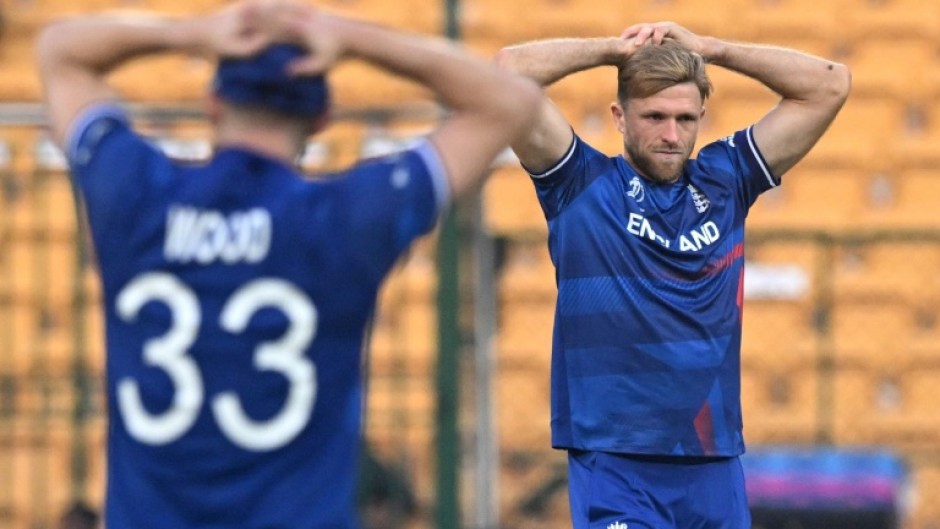 That losing feeling: England's David Willey (right) and Mark Wood react after a dropped catch off Sri Lanka captain Kusal Mendis on Thursday