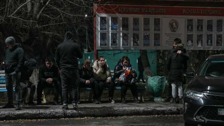 Relatives of miners gather outside the Kostyenko ArcelorMittal coal mine building 