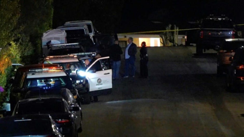 In this screen grab from an AFPTV video, police officers taped off the street leading to Matthew Perry's house in Los Angeles