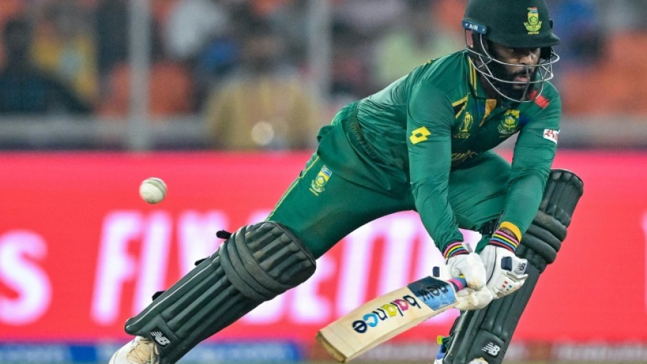 In pain: South Africa's captain Temba Bavuma plays a shot on Friday 