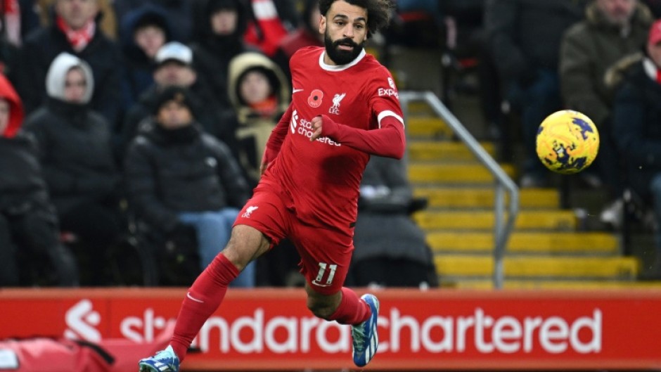 Liverpool star Mohamed Salah runs with the ball against Brentford at Anfield

