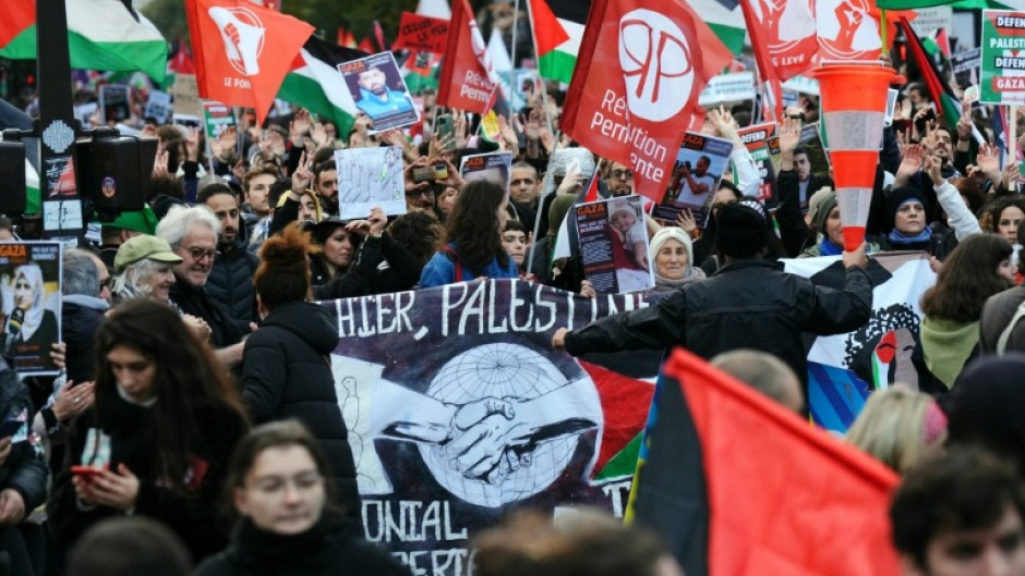 The left-wing organisers of the protest called for France to 'demand an immediate ceasfire' between Israel and Hamas militants
