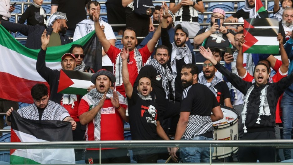 Supporters waved Palestinian flags at the game against Australia in Kuwait City