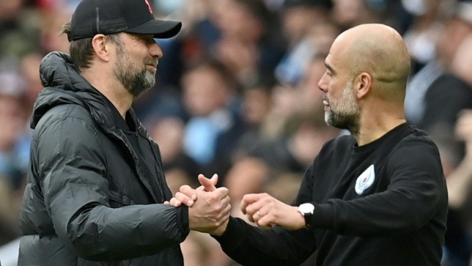 Jurgen Klopp (left) is preparing his Liverpool side to face Pep Guardiola's Manchester City