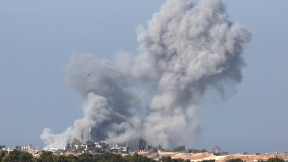 A picture taken from southern Israel near the border with the Gaza Strip on December 4, 2023, shows smoke billowing over the Palestinian territory following Israeli bombardment 