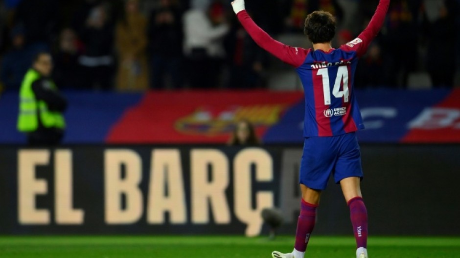 Barcelona forward Joao Felix celebrates scoring the opening goal against his parent club Atletico Madrid on Sunday in La Liga