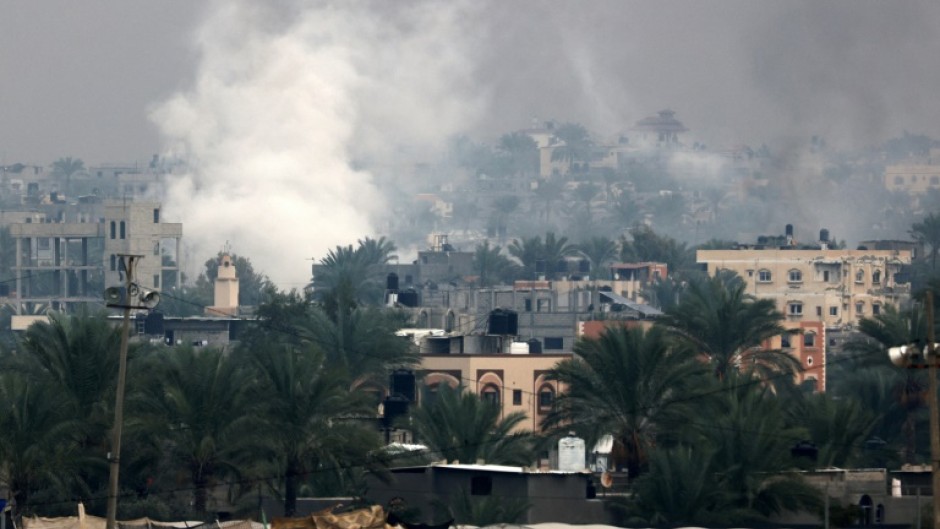 Smoke rises above Khan Yunis in southern Gaza as Israeli troops engage in ground combat in the city