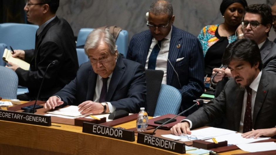 UN Secretary-General Antonio Guterres (2L) speaks during a United Nations Security Council meeting on Gaza