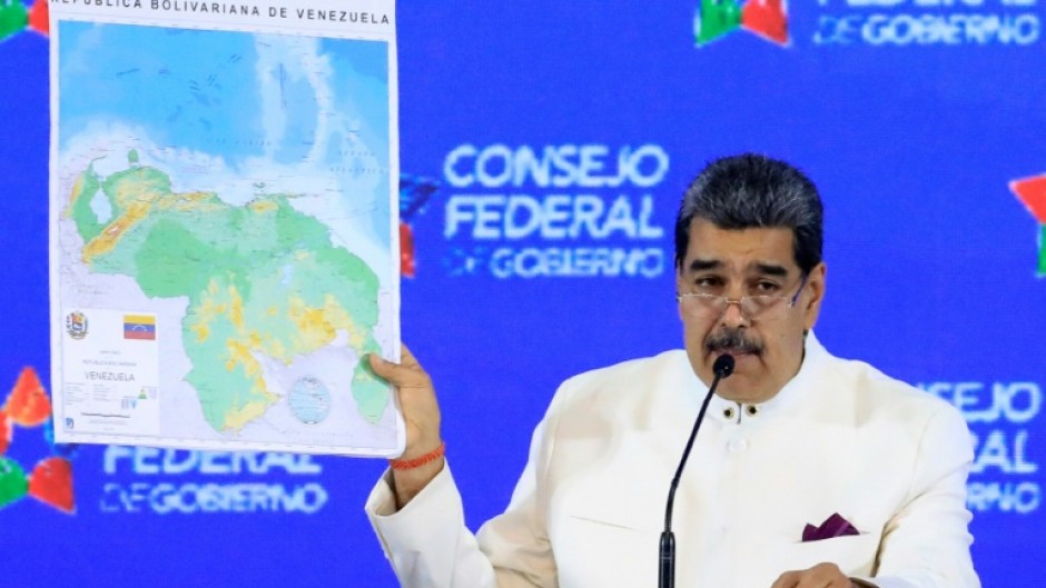 President Nicolas Maduro displays a map of the Essequibo region he claims as part of Venezuela 