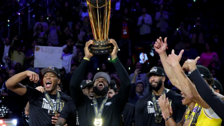 LeBron James celebrates with teammates after capturing the NBA Cup with a victory over the Indiana Pacers in the final of the league's first-ever in-season tournament